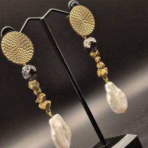 golden hanging earrings with mother of pearl