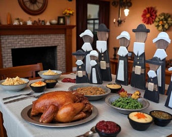 May include: A Thanksgiving dinner table setting featuring a roasted turkey on a platter, various side dishes in bowls, and a collection of wooden pilgrim figurines painted in black, white, and natural wood tones standing on the table.