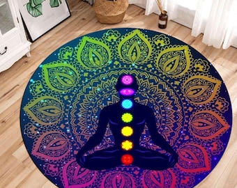 May include: Round mandala rug with a colorful design featuring a meditating figure with seven chakras. The rug has a dark blue background with a rainbow mandala pattern.