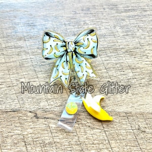 Banana coquette bow acrylic badge reel