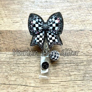 Checkered coquette bow acrylic badge reel