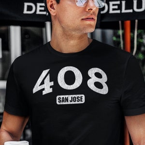 May include: A black t-shirt with a white graphic of the number 408 and the words "San Jose" underneath.