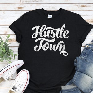 HUSTLE TOWN Shirt, Unisex • Houston TX shirt w original script design in white w distressed vintage style texture, Houston Texas shirt gift