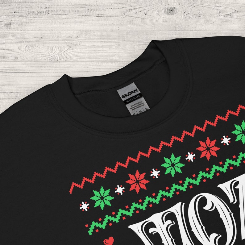 May include: Black sweatshirt with a white "HO HO HO" graphic in a festive Christmas-themed design. The graphic features red and green snowflakes and a red heart.