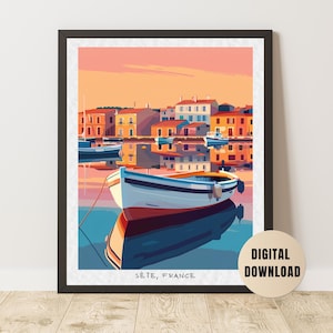 May include: Digital art print of a harbour scene in Sète, France. The image shows a boat in the foreground, with colourful buildings and boats in the background. The sky is a gradient of orange and pink. Text on the bottom reads "Sète, France."