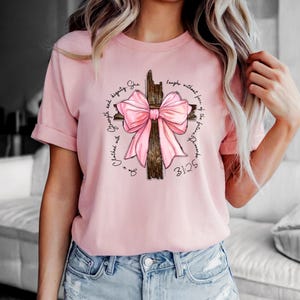 Christian Cross Coquette Bow Shirt Bible Verse Faith Shirt She Is Strong Religious Gift Pink Bow Christian Shirt Church Shirt Christian Gift