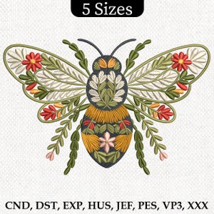 May include: Embroidered bee design with floral details in shades of green, yellow, red, and white. The bee is stylized with a round body and wings. The design is available in five sizes.