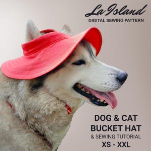 May include: A husky dog wearing a bright red bucket hat. The image includes the text "La Island DIGITAL SEWING PATTERN" and "DOG & CAT BUCKET HAT & SEWING TUTORIAL XS - XXL". The dog has a pink tongue and is looking to the right.