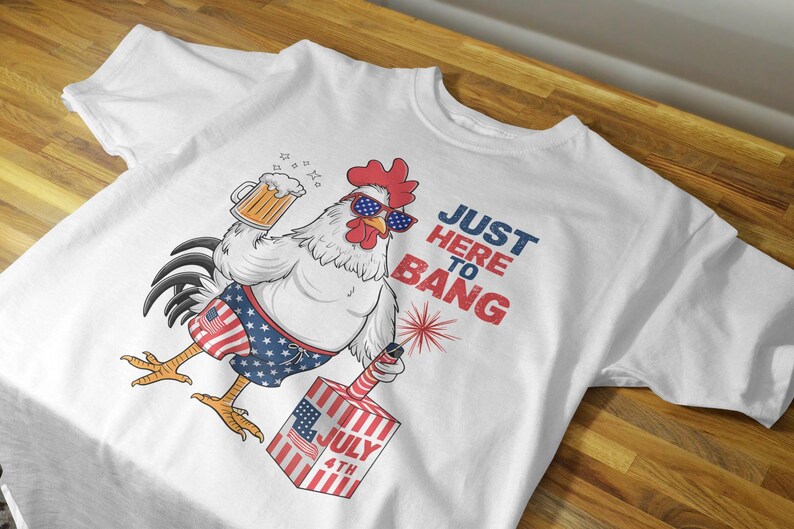 May include: White t-shirt with a cartoon rooster wearing sunglasses and holding a beer. The rooster is wearing red, white, and blue swim trunks and holding a firework. The text "Just Here To Bang" is printed on the shirt.