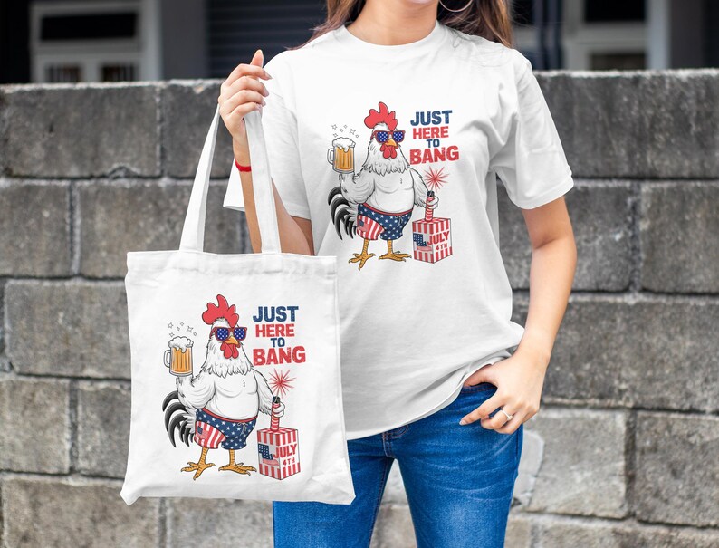 May include: White tote bag with a red, white, and blue rooster holding a beer and a firework. The text on the bag reads "Just Here To Bang".