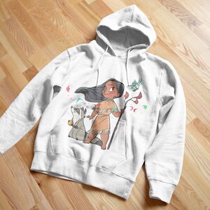 May include: White hooded sweatshirt with a colorful cartoon illustration of a Native American girl with long black hair, wearing a brown dress and holding a stick. A raccoon is standing next to her.