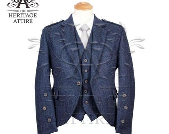 May include: A dark blue three-piece suit with a vest and a jacket. The jacket has buttons and a pocket on the left side. The suit is made of a tweed fabric.