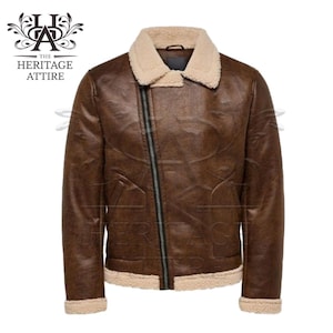May include: A brown faux leather jacket with a shearling collar and zipper closure. The jacket has a zippered pocket on the left side and a zippered pocket on the right side.
