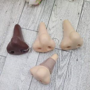 ORNAMENT Fake Nose Finger Ring with a Nose Stud Bone - Gag Gift - Pun - Prank - White Elephant - Teenager Gift - Faux - Non Piercing
