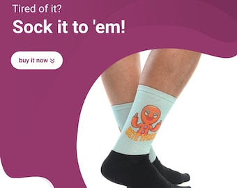 May include: A pair of blue socks with a black heel and toe. The socks feature a cartoon gingerbread man with the text "Bite Those" printed on the socks.