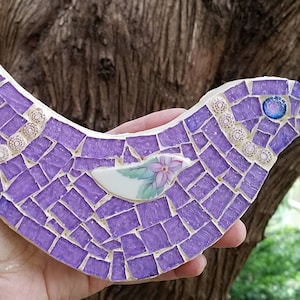 Mosaic bird with broken China pieces and stained glass in lavender