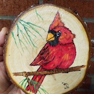 Painted Cardinal on wood discs