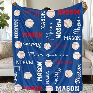 May include: A blue baseball-themed blanket featuring the name "Mason" in various fonts and baseballs. The name is in white and red, with baseballs scattered across the blanket. A cozy and personalized gift.