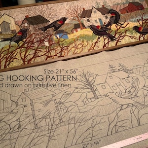 May include: A hand-drawn rug hooking pattern on linen featuring a country scene with houses, trees, and birds. The pattern is 21 inches by 56 inches. "RUG HOOKING PATTERN" and "Hand drawn on primitive linen" are written in black text.