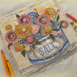 May include: A needlepoint design of a salt container with a bouquet of pink, yellow, and green flowers. The container is labelled "SALT".