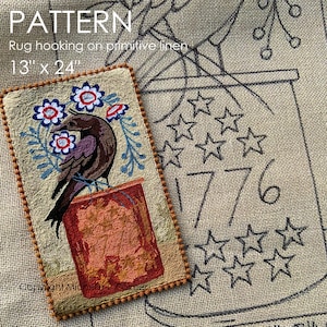May include: A rectangular rug hooking pattern on primitive linen, featuring a bird perched on a red structure, surrounded by blue and red floral accents. The design includes the text "1776" and star outlines. The pattern measures 13" x 24".