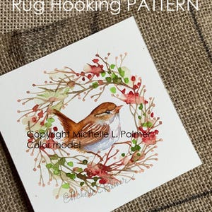May include: Watercolor painting of a small brown bird perched inside a wreath of red berries and green leaves. The text "Rug Hooking PATTERN" is at the top, with "Copyright Michelle L. Palmer Color model" below the bird.