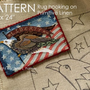 May include: A rug hooking pattern on primitive linen, featuring an American flag design with an eagle and the word "LIBERTY". The pattern measures 32" x 24". The design includes stars, stripes, and a banner. Copyright Michelle L. Palmer.