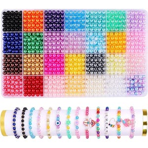 May include: A clear plastic organizer filled with colorful beads in various shades, including black, orange, purple, and blue. Below, a display of beaded bracelets in assorted colors and designs, some with charms and the word "LUCKY".