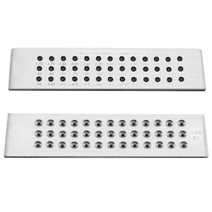 May include: A silver metal plate with a series of holes of different sizes. The plate is labelled "TUNGSTEN CARBIDE DRAWPLATES" and has measurements in inches. The plate is labelled "SRM 20".