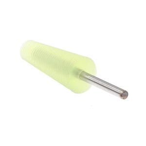 May include: A pale yellow, cylindrical tool with a ridged body and a silver metal rod extending from one end. The tool is designed for a specific purpose, likely in a workshop or craft setting.