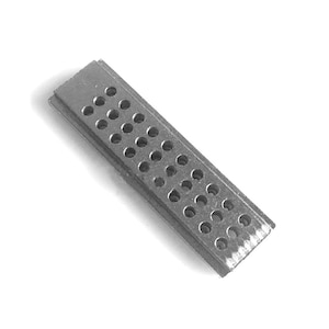 May include: A rectangular metal object with numerous small, evenly spaced holes. The object appears to be made of a silver-colored metal and has a slightly textured surface. The holes are circular and arranged in a grid-like pattern.