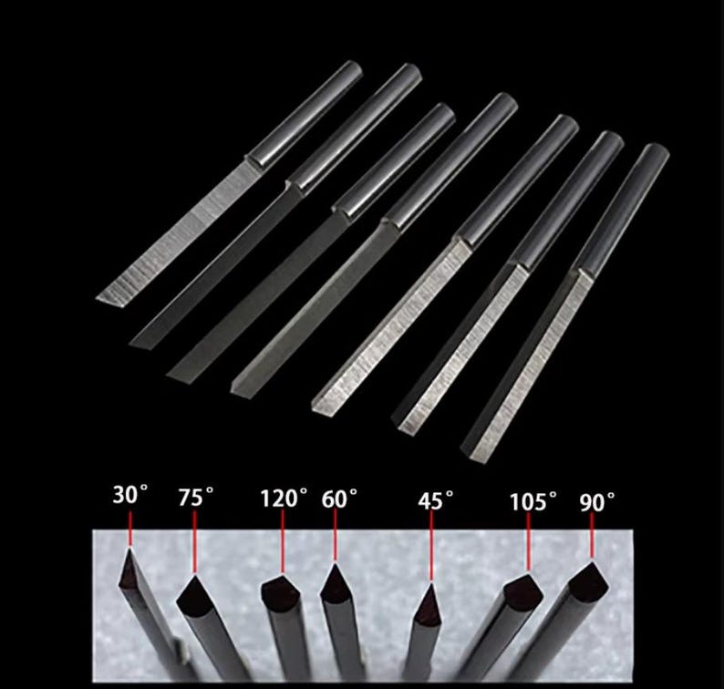 May include: Set of 7 silver-colored metal carving tools with different angled tips. The tips are labeled with angles: 30&deg;, 75&deg;, 120&deg;, 60&deg;, 45&deg;, 105&deg;, and 90&deg;.