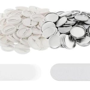 May include: A selection of blank, round pinback buttons and their components, including white button fronts, silver metal backs, and clear plastic covers. The buttons are ready for custom designs and are ideal for crafting or promotional use.