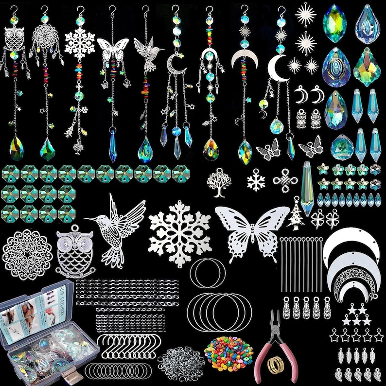 May include: A collection of sun catchers and crafting supplies. Includes crystal pendants, metal charms in various shapes like butterflies and moons, beads, chains, and tools. The color palette features clear, iridescent, and silver tones.