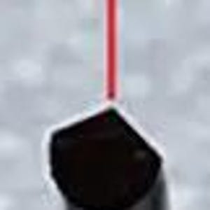 May include: A close-up of a black object with a red laser beam pointing at it. The text "120&deg;" is visible above the object.