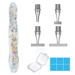 May include: A clear, glitter-filled pen-like tool with a silver tip, alongside four silver drill pen tips, a small clear square container, and a blue square with six smaller squares. The pen is filled with colourful confetti.