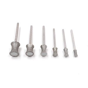 May include: Set of six diamond-tipped drill bits for use with a rotary tool. The bits are different sizes and shapes, with a silver finish.
