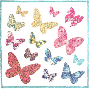 May include: A white background with a variety of colorful butterflies with floral patterns. The butterflies are all different sizes and shapes.