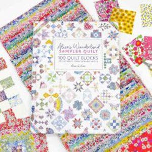 May include: A book titled "Alice's Wonderland Sampler Quilt: 100 Quilt Blocks to Enchant Your Sewing Days" by Kim Diehl. The cover features a colorful patchwork quilt with various floral and geometric patterns.