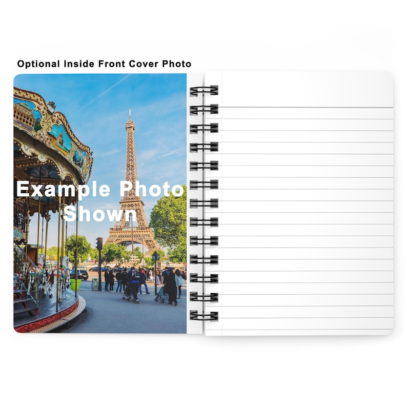 Paris notebook placed on a white desk with Eiffel Tower and watercolor buildings