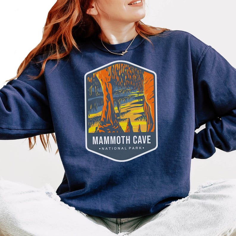 Unisex Mammoth Cave National Park sweatshirt featuring a relaxed fit, ribbed cuffs, and OEKO-TEX certified dyes. Made from durable, soft fabric with a fleece interior. Colors: Pepper, Terracotta, Butter, White, Blue Spruce, Blue Jean, and True Navy.