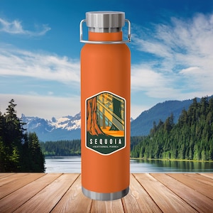 May include: Orange stainless steel water bottle with a graphic of a redwood tree and the text "Sequoia National Park".