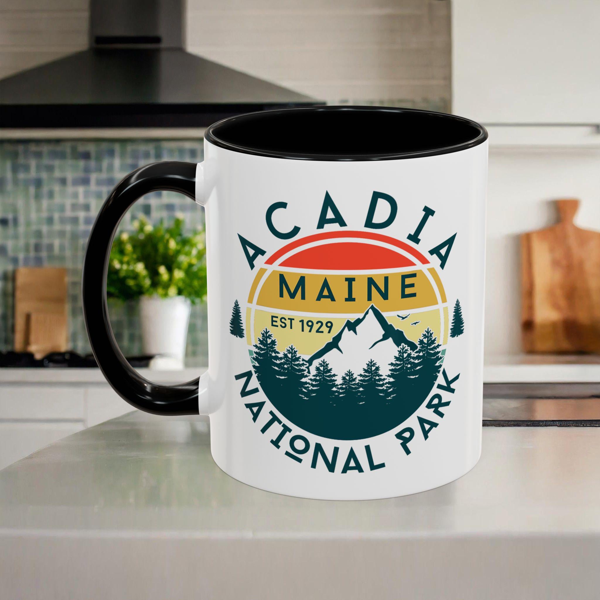 Handmade Acadia National Park ceramic mug with colored handle from Etsy artisan