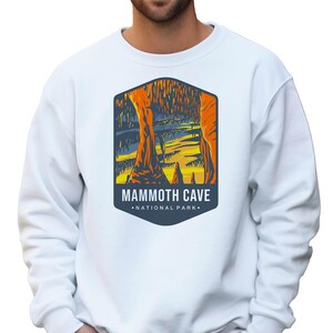 Unisex Mammoth Cave National Park sweatshirt featuring a relaxed fit, ribbed cuffs, and OEKO-TEX certified dyes. Made from durable, soft fabric with a fleece interior. Colors: Pepper, Terracotta, Butter, White, Blue Spruce, Blue Jean, and True Navy.