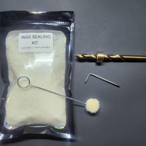 May include: A wax sealing kit with a black bag containing 3 oz of wax, a wool dauber, a drill bit, and an Allen wrench. The kit includes all the necessary tools for wax sealing.
