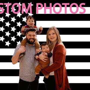 May include: A family of four poses in front of a black and white American flag backdrop. The text "CUSTOM PHOTOS" is displayed in pink letters at the top. The family includes a man, a woman, and two young children.