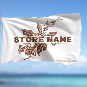 May include: A white flag with a brown coffee plant design and the text "STORE NAME" in brown. The flag is waving in the wind against a blue sky and ocean background.