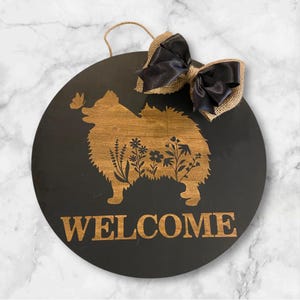 Welcome wood wild flower black Pomeranian door hanger sign 16” round