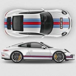 May include: A white Porsche 911 with blue, red, and white racing stripes and a Martini Racing logo on the side. The car is shown from both the top and side views.