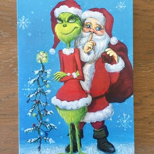 Cartão do feriado "Papai Noel e Grinch!" por Lori Gutiérrez